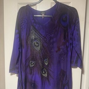 Jostar purple blouse. Embellished peacock feathers. Shark bite hem.